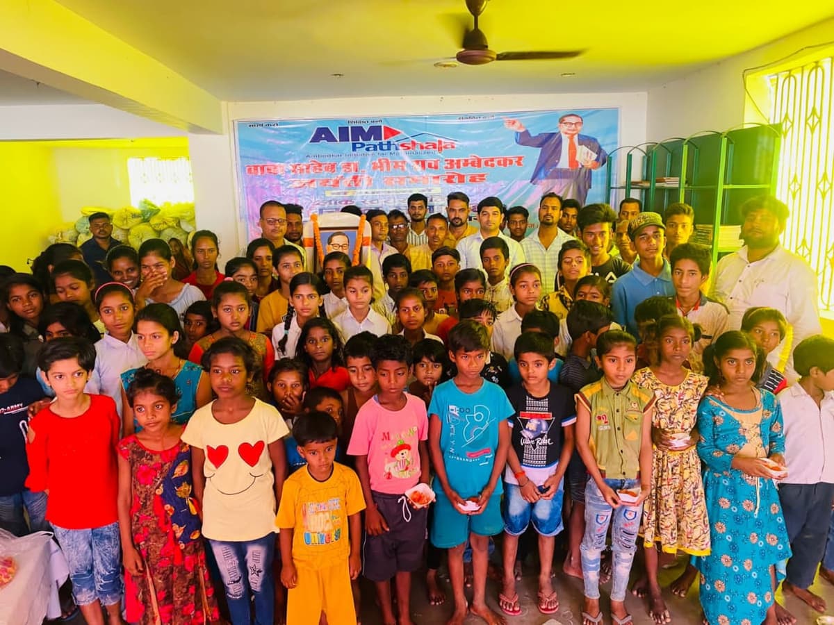 Students with AIM Pathshala banner